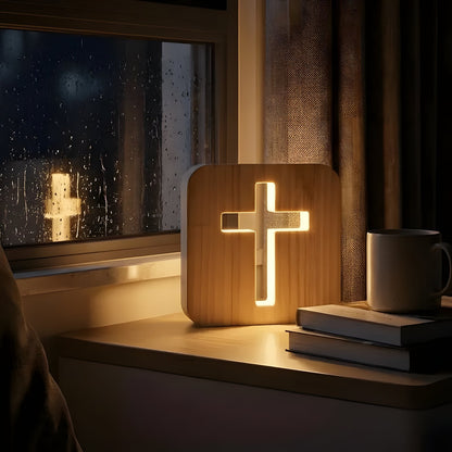 Wooden cross lamp glowing on a rainy window sill